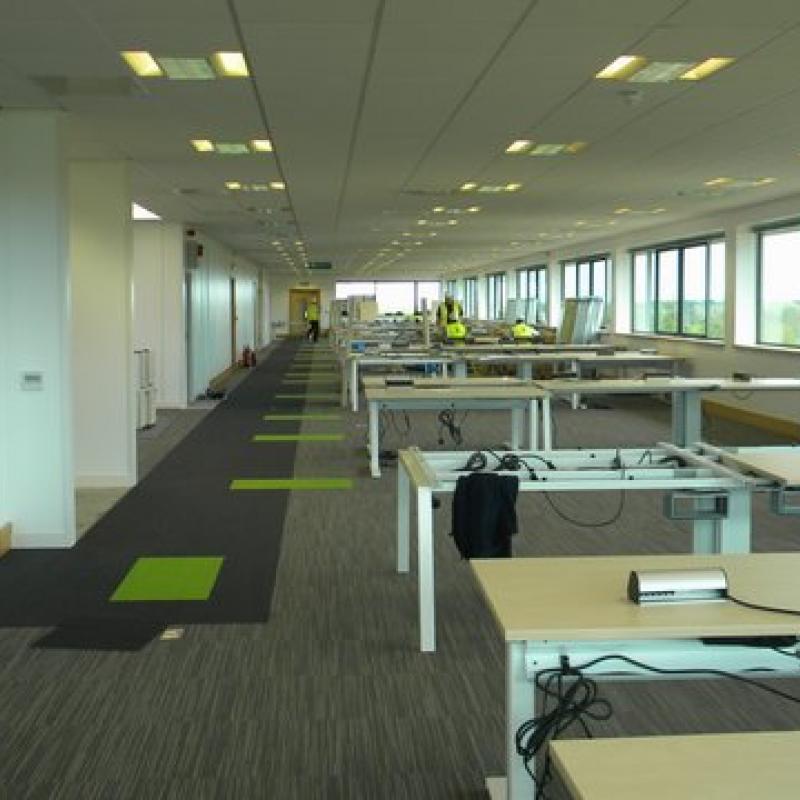 view of open plan office with desks under construction