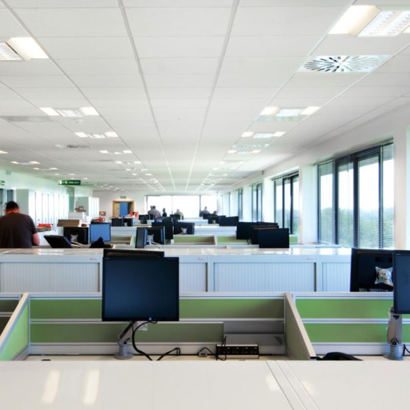 view of open plan layout with desks having IT installed